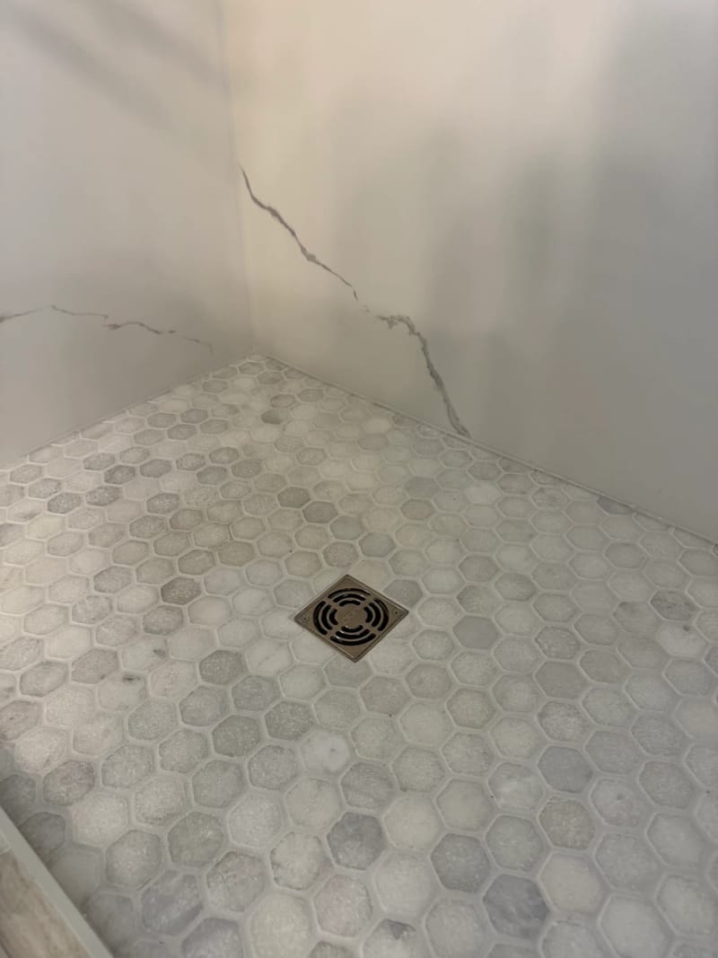 Marble hex mosaic shower pan with square drain in a Sacramento shower remodel